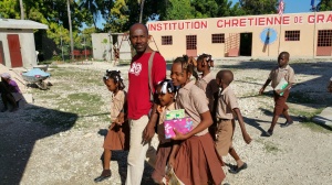 Pastor Benito and some students walking to the office.