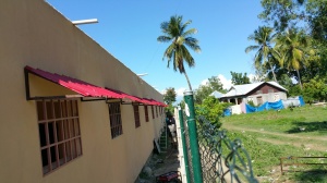View of awnings and fence on school building one.